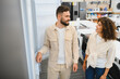 © Serhii - Couple choosing refrigerator in electronics store