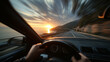 © Enrique - speeding car driving along a coastal highway, POV from driver’s chest, hands on the wheel, scenic sunset