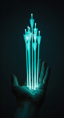 Wall Mural - glowing teal arrows rest in a hand, symbolizing achievement, progress, or guidance. dark background 