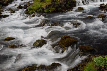 Canvas Print - water creek flowing between rocks.