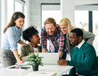© Lumos sp - Group of young business people using laptop having a meeting or presentation and seminar in the office