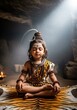 © DWIJ - A young child dressed as lord shiva meditates peacefully in a cave, embodying hindu spirituality