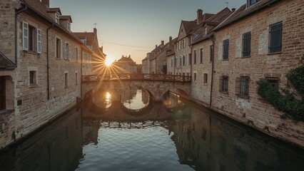 golden sunset over a charming canal with historic stone houses and a beautiful arch bridge.