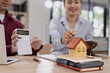 © SOMKID - Real estate agents agree to buy a home, Agreement and customer discussing for contract concept.