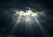 © Rizki - Dramatic sun rays piercing through a dark, stormy sky, symbolizing hope, spirituality, and a breakthrough of light in challenging times.