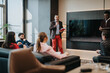 © qunica.com - A group of professionals having an informal meeting with a presenter sharing ideas in a contemporary office setting. The focus is on teamwork and discussing project goals.