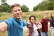© New Africa - Team building. Group of happy people holding hands outdoors, selective focus
