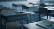 © Octopus16 - Empty classroom with desks and chairs, open book in the foreground, soft focus.