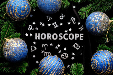 abstract new year background with the inscription horoscope on a black velvet background.