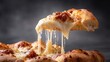 © gankevstock - Slice of pizza with melting cheese being lifted over the rest of pizza