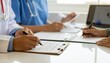 © Eduardo - Team of doctors in the hospital working on documents, 300 dpi, widescreen 16:9, with free space for text