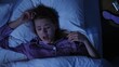© kinomaster - Tired woman yawning in bed at night, struggling to fall asleep