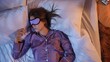 © kinomaster - Peaceful sleep with eye mask during night insomnia recovery