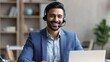 © Johannes - Indian business man professional employee, remote consultant, customer service support manager wearing headset talking at virtual meeting consulting client on video call at home office call center.,