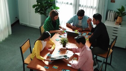Wall Mural - top view of business team writing sticky notes while manager working on tablet and looking at analys