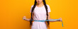 © Prostock-studio - Weight Loss And Dieting. Sad And Disappointed Indian Woman Measuring Waist With Tape, Unhappy About Her Body Parameters, Standing Isolated Over Yellow Studio Background. Slimming Concept. Free Space