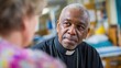 © Justlight - Closeup of chaplain attentively listening to a patients concerns in a ward providing emotional and spiritual guidance in a compassionate setting.