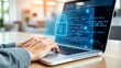 © ranggasae - A person's hands typing on a laptop with a glowing holographic padlock icon on the screen. Concept of cybersecurity, data protection, and internet security.