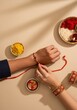 © Kamlesh - Top view of a woman tying rakhi on a mans wrist during raksha bandhan celebration