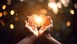 © Ramavanjava - Two hands gently hold a glowing heart-shaped light against a blurred background of sparkling bokeh lights.