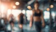 © balmond - Blurry gym interior, people working out