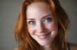 © Daniel - A woman with red hair and blue eyes smiling directly at the camera