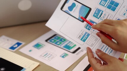 Wall Mural - excellent startup company employee presenting user interface prototype for mobile application to sma