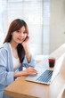 © Thinapob - Portrait of asian freelance teenage people business woman casual working with laptop computer in cafe interior in coffee shop background,business expressed confidence embolden and successful concept