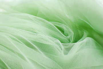 A close-up photo of beautiful, elegant, soft, detailed, textured, and wavy tulle fabric.