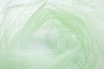 A close-up photo of beautiful, elegant, soft, detailed, textured, and wavy tulle fabric.