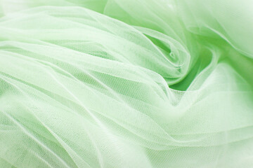 A close-up photo of beautiful, elegant, soft, detailed, textured, and wavy tulle fabric.