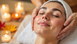 © Valeriy - Woman relaxing during facial spa treatment in autumn-themed room, self-care