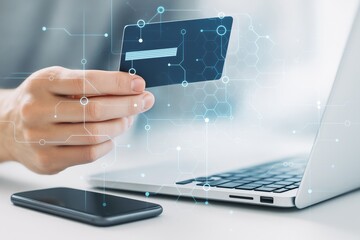 Wall Mural - person holding credit card near smartphone and laptop with digital circuit overlay on light backgrou