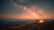 © Aom - A person standing beside a glowing tent on a mountaintop during twilight, under a sky full of stars and the Milky Way , capturing the spirit of solitude and connection with nature.