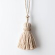 © Fomo Creative - Beige Ornamental Fiber Tassel Hanging Decoration on a White Background
