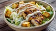 © Nattapol - Caesar salad with grilled chicken croutons and creamy dressing in a ceramic bowl
