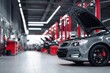 © ttonaorh - Car repair shop, a gray car with an open hood on the right side of an automotive workshop in a modern style with red pillars, cars standing at their stations for servicing. The background is blurred.