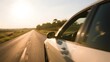 © Peter - Car driving on a straight road during sunset