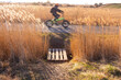 © yaqui_villegas - Cyclist riding past a wooden bridge surrounded by reeds, captured in motion to highlight the coexistence of nature and sustainable outdoor recreation in wetlands.