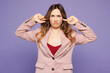 © ViDi Studio - Young indignant outraged woman wear beige jacket formal clothes cover ears with hands fingers do not want to listen scream isolated on plain light purple background studio portrait. Lifestyle concept.