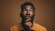 © Noize - African American male thinking. Creative Thinking: Expressive Facial Gesture of an African American Male