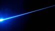 © goslim - A blue laser beam with an intense diffused light source on the left side against a completely black background