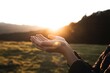 © Mustafa - Embrace the golden hour's promise with open hands reaching towards a bright, hopeful sunrise over a serene landscape