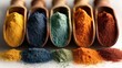 © don - Vibrant Powder Pigments: A visual feast of colorful pigments is presented in wooden spoons, displaying a spectrum of vibrant colors. These finely ground powders, ideal for artistic endeavors.