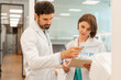 © Maria Vitkovska - Doctors discussing medical chart with statistics in hospital corridor