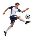 Agile men soccer player leaps to strike incoming ball jumping in the air