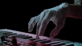 Polygonal hand playing a digital keyboard, creating a futuristic and technological music performance