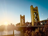 golden Tower Bridge over the Sacramento River. The bridge is the western downtown entry point to the city of Sacramento, capital of California
