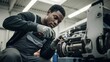 © Eko - Young man repairing industrial machine in workshop