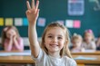 © Thorng - Cheerful student girl eager to answer, hand raised in elementary classroom with positive atmosphere